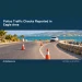 Police Traffic Checks Reported in Eagle Area Conceptual editorial illustration of empty coastal road with simple generic traffic cones and an unmarked patrol vehicle in morning light, ground-level view, no drivers, plates, recognizable signs, official emblems or text. Not a photograph of the actual incident or location.