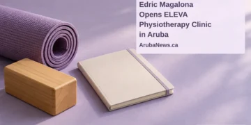 Edric Magalona Opens ELEVA Physiotherapy Clinic in Aruba Conceptual editorial illustration of a rolled exercise mat, wooden balance block and blank notebook on a lilac tabletop, with the article headline and ArubaNews.ca branding.