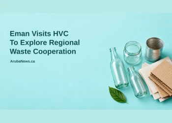 Conceptual editorial illustration of sorted recyclable glass, cardboard and a metal can, not an actual HVC facility or proposed plant, with the regional waste cooperation headline and ArubaNews.ca branding.