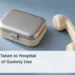 Conceptual illustration of a plain closed supply case and blank telephone handset on a pale blue tabletop, not actual medical evidence, with the article headline, ArubaNews.ca branding and editorial-illustration label.