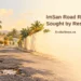ImSan Road Repairs Sought by San Nicolas Residents Conceptual editorial illustration of a worn Caribbean neighbourhood road with potholes, not the actual ImSan road, with a residents’ repair-appeal headline and ArubaNews.ca branding.