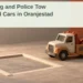 Conceptual editorial illustration of a model tow truck beside an empty parking bay and unmarked meter, with the Oranjestad towing headline and ArubaNews.ca branding; not an actual enforcement scene.