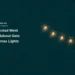 Conceptual pointillist illustration of a curved strand of warm fairy lights on midnight teal; not the actual Oranjestad West roundabout or installed Christmas display.