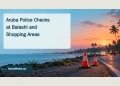 Conceptual editorial illustration of traffic cones beside a tropical coastal road at dusk, with distant anonymous vehicles and a headline about Aruba police checks; not a photograph of the reported checks.