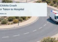 Driver Taken to Hospital After Pos Chikito Roundabout Crash Conceptual editorial illustration of a generic roundabout and ambulance; not a photograph or reconstruction of the Pos Chikito crash.