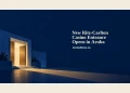 Conceptual editorial illustration of a generic illuminated doorway, indigo architectural shapes and a warm light beam, with the entrance-opening headline and ArubaNews.ca branding; not a depiction of the actual Ritz-Carlton entrance.