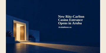 Conceptual editorial illustration of a generic illuminated doorway, indigo architectural shapes and a warm light beam, with the entrance-opening headline and ArubaNews.ca branding; not a depiction of the actual Ritz-Carlton entrance.
