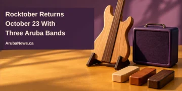 Rocktober Returns October 23 With Three Aruba Bands Conceptual editorial illustration of a wooden guitar form, plain amplifier and rhythm blocks on an ochre tabletop, with the article headline and ArubaNews.ca branding.