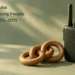 Scouting Aruba Connects Young People Through JOTA–JOTI Conceptual editorial illustration of a radio handset, linked wooden rings and a blank-faced compass on a sage surface, with the article headline and ArubaNews.ca branding.