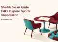Conceptual editorial illustration of two empty contemporary meeting chairs beside an unbranded swimming lane rope and a blank sports planning notebook, with the article headline and ArubaNews.ca branding.