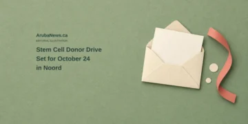 Stem Cell Donor Drive Set for October 24 in Noord Conceptual editorial illustration of a blank ivory card in an open envelope beside a coral paper ribbon on sage-green paper, with the headline Stem Cell Donor Drive Set for October 24 in Noord and ArubaNews.ca branding.